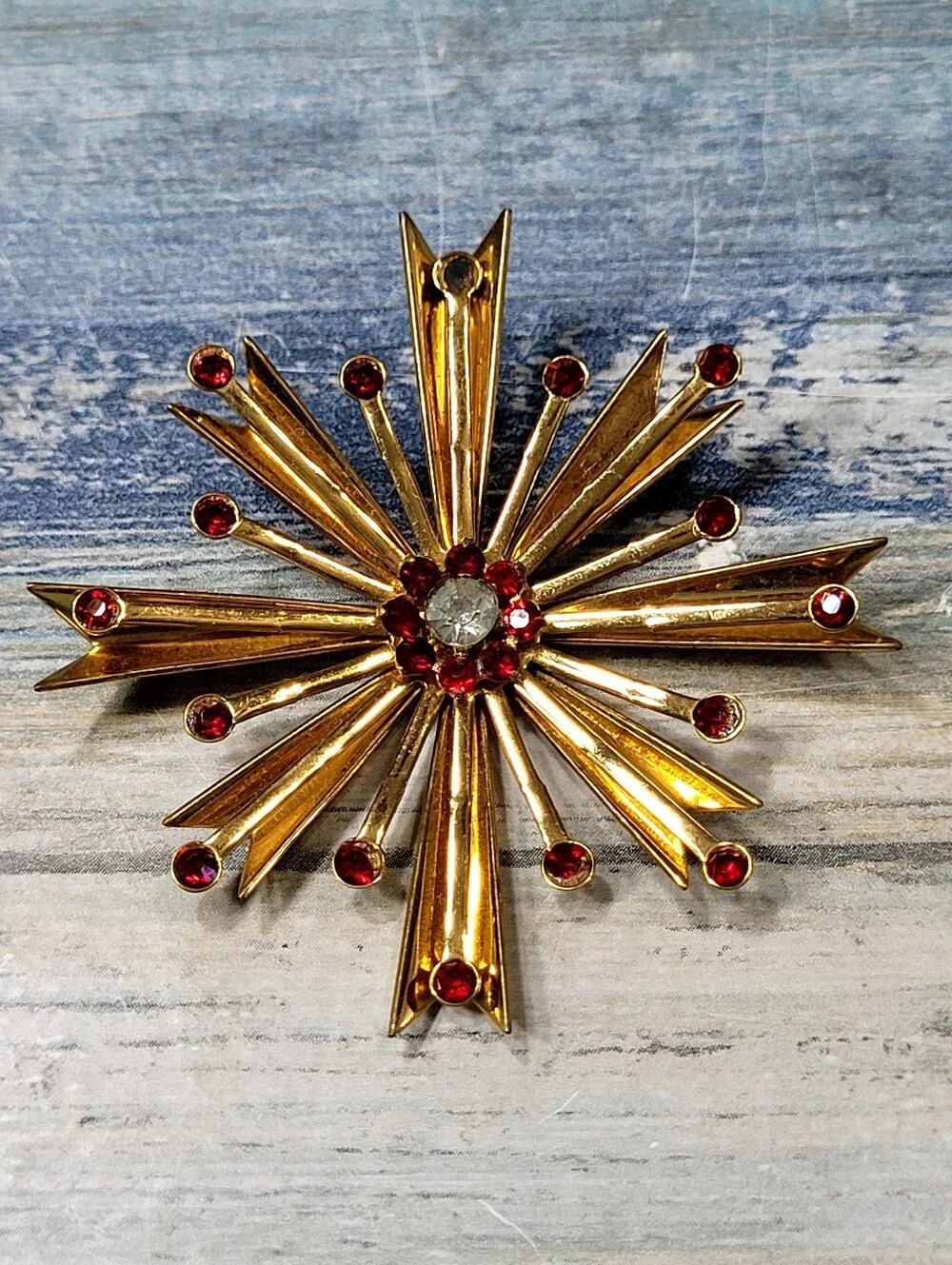 Gold Starburst Brooch and Earring Set with Red Rhinestones
